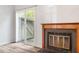 Comfortable living room features a fireplace, with sliding glass doors providing access to the outdoors at 14 Stone Village Ct, Durham, NC 27704