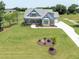 Expansive property with a meticulously maintained lawn, complemented by mature trees and lush landscaping at 20 Water Willow Ln, Zebulon, NC 27597