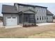 Large backyard featuring a screened porch and an attached two-car garage, enhancing outdoor living and convenience at 20 Water Willow Ln, Zebulon, NC 27597