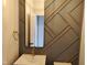 Stylish powder room featuring a modern sink vanity, mirror, and gold fixtures at 20 Water Willow Ln, Zebulon, NC 27597