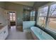 Modern bathroom featuring freestanding tub and separate shower at 20 Water Willow Ln, Zebulon, NC 27597