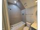 Bathroom featuring tub, tiled walls, and sleek fixtures at 20 Water Willow Ln, Zebulon, NC 27597