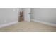 Bedroom with neutral walls, carpet floors, white trim and a door leading to the hallway at 20 Water Willow Ln, Zebulon, NC 27597