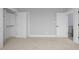 Spacious bedroom with neutral carpet, closet and en suite doors creates a calming sanctuary at 20 Water Willow Ln, Zebulon, NC 27597