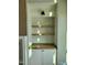 Built-in shelving with white trim cabinets and stained wood shelves at 20 Water Willow Ln, Zebulon, NC 27597