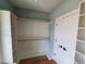 Spacious walk-in closet featuring ample shelving and rod space at 20 Water Willow Ln, Zebulon, NC 27597