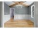 Cozy dining room featuring wood beams, wainscoting, hardwood floors, and a modern chandelier at 20 Water Willow Ln, Zebulon, NC 27597