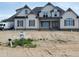 New construction home with modern farmhouse design, featuring board and batten siding at 20 Water Willow Ln, Zebulon, NC 27597
