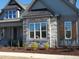 Beautiful home exterior with a stone facade, complementary shutters, and professionally landscaped yard at 20 Water Willow Ln, Zebulon, NC 27597