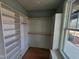 Spacious walk-in closet with custom shelving and natural light, perfect for organization at 20 Water Willow Ln, Zebulon, NC 27597