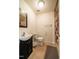 Simple bathroom with a toilet, vanity sink, and shower with curtain at 229 Rose Walk Ln, Carrboro, NC 27510