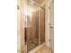Modern bathroom featuring tiled shower with glass door and neutral color palette at 229 Rose Walk Ln, Carrboro, NC 27510