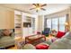 Bright living room boasts hardwood floors, built-in shelving, and an inviting seating area with a large window at 229 Rose Walk Ln, Carrboro, NC 27510