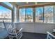 Bright sunroom with a ceiling fan and large windows providing views of the neighborhood at 229 Rose Walk Ln, Carrboro, NC 27510