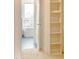 View through doorway to bathroom with soaking tub and shelving to the right at 2401 Terri Creek N Dr # 08, Fuquay Varina, NC 27526