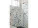 Shower featuring marble tiling and a frameless glass door at 2401 Terri Creek N Dr # 08, Fuquay Varina, NC 27526