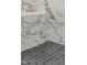 Detail of tiled corner bench in the shower with dark tile floor at 2401 Terri Creek N Dr # 08, Fuquay Varina, NC 27526