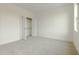 Bedroom with large closet and neutral carpeting at 2401 Terri Creek N Dr # 08, Fuquay Varina, NC 27526