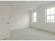 Bright bedroom with two windows and neutral carpeting at 2401 Terri Creek N Dr # 08, Fuquay Varina, NC 27526