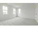 Bright bedroom features neutral carpet, a large window, and a closet at 2401 Terri Creek N Dr # 08, Fuquay Varina, NC 27526