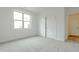 Comfortable bedroom featuring soft carpet, closet, and large window with ample natural light at 2401 Terri Creek N Dr # 08, Fuquay Varina, NC 27526