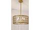 Close-up of a modern, geometric brass chandelier at 2401 Terri Creek N Dr # 08, Fuquay Varina, NC 27526