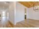 Bright dining room featuring a wooden ceiling, hardwood floors, and modern light fixture at 2401 Terri Creek N Dr # 08, Fuquay Varina, NC 27526