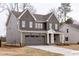 Charming two-story home with gray siding, white trim, and a two-car garage at 2401 Terri Creek N Dr # 08, Fuquay Varina, NC 27526