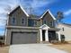 Traditional two-story home with modern garage and covered entryway at 2401 Terri Creek N Dr # 08, Fuquay Varina, NC 27526