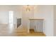 Elegant hallway showcases modern lighting and staircase to the lower level at 2401 Terri Creek N Dr # 08, Fuquay Varina, NC 27526
