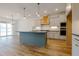 Bright, open kitchen with a large island, and hardwood flooring, flowing into the living area at 2401 Terri Creek N Dr # 08, Fuquay Varina, NC 27526