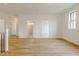 Spacious living room with light floors and multiple open doorways, offering a flexible layout at 2401 Terri Creek N Dr # 08, Fuquay Varina, NC 27526