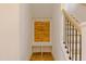 Mudroom with custom built-ins that offer storage space, along with a stairwell with wood treads at 2401 Terri Creek N Dr # 08, Fuquay Varina, NC 27526