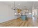Open-concept space featuring stylish lighting over the kitchen island and an open staircase, blending modern design at 2401 Terri Creek N Dr # 08, Fuquay Varina, NC 27526