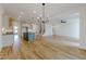 Expansive open-concept layout showcasing kitchen and living areas with stylish flooring and recessed lighting at 2401 Terri Creek N Dr # 08, Fuquay Varina, NC 27526