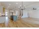 Spacious open concept layout showing the kitchen, living, and staircase, perfect for Gathering living and entertaining at 2401 Terri Creek N Dr # 08, Fuquay Varina, NC 27526