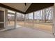 Inviting screened porch with neutral flooring and serene views of the expansive backyard at 2401 Terri Creek N Dr # 08, Fuquay Varina, NC 27526