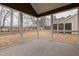 Screened porch featuring gray flooring and views of the large backyard at 2401 Terri Creek N Dr # 08, Fuquay Varina, NC 27526