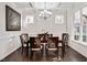 Bright dining room with coffered ceilings, hardwood floors, and large windows at 2618 Needle Pine Dr, Apex, NC 27539