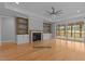 Open living room with a fireplace, built-in shelving, and sliding doors to a patio at 5100 Grist Stone Way, Youngsville, NC 27596