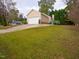 Exterior view of a two-car garage with a driveway and grassy front yard at 6220 Sweden Dr, Raleigh, NC 27612