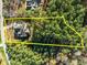Aerial view of a home with a tree-lined lot in a gated community at 181 Colonial Ridge Dr, Pittsboro, NC 27312