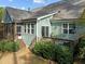 Back exterior featuring a wooden deck with stairs leading to a well manicured yard at 181 Colonial Ridge Dr, Pittsboro, NC 27312