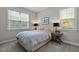 Serene bedroom featuring soft lighting, neutral tones, and coordinating nightstands for a relaxing retreat at 181 Colonial Ridge Dr, Pittsboro, NC 27312