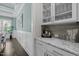 Convenient butler pantry with elegant cabinetry, granite countertops, and ample storage space at 181 Colonial Ridge Dr, Pittsboro, NC 27312
