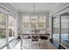 Charming dining area with natural light, modern lighting, and easy access to outdoor deck at 181 Colonial Ridge Dr, Pittsboro, NC 27312