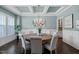 Stylish dining room with coffered ceiling, modern chandelier, and beautiful decor creating a welcoming space at 181 Colonial Ridge Dr, Pittsboro, NC 27312
