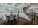 Dining room with elegant coffered ceiling, wood floors, and staircase access, ideal for entertaining guests at 181 Colonial Ridge Dr, Pittsboro, NC 27312