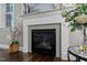 Close-up of fireplace showcasing the decorative tile work and stylish mantle at 181 Colonial Ridge Dr, Pittsboro, NC 27312