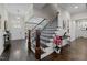 Inviting foyer with staircase, stylish decor, and natural light, creating a warm welcome at 181 Colonial Ridge Dr, Pittsboro, NC 27312